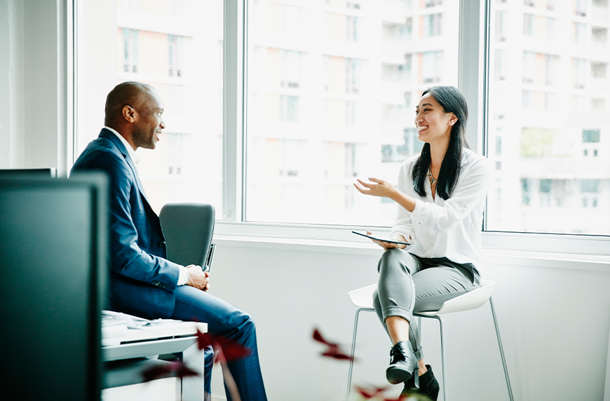 Physician recruiter speaking to colleague