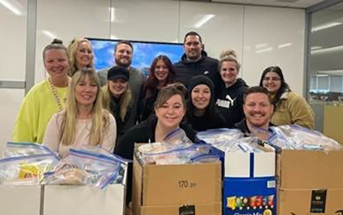 CHG employees with hygiene kits