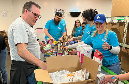 CHG employees sorting food donations at the Utah Food Bank